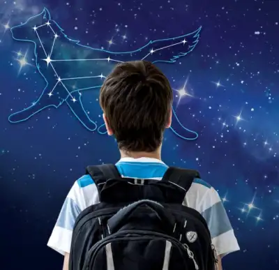 A person is looking at a backpack that has an image of a blue bird on it.